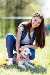 portrait of Beautiful young girl with her dogs  