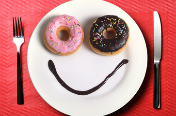 smiley happy face on dish donuts eyes  chocolate smile