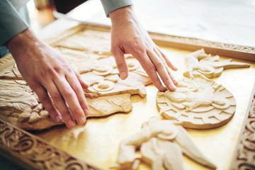 hand woodcarver to cut them a icon