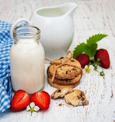 Milk, cookies and strawberries