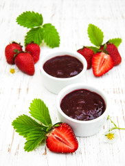 Strawberry jam and fresh strawberries