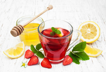Fruit tea with strawberries and honey