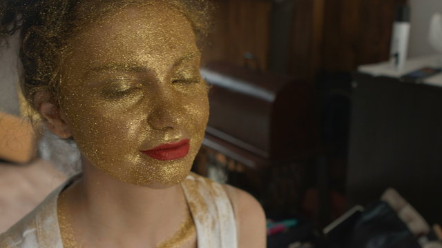 Woman With Art Fashion Make Up On Face. Gold Skin Type Make Up