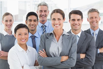 Obraz premium Business people looking at camera with arms crossed