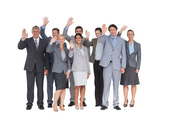 Fototapeta premium Smiling business team waving at camera