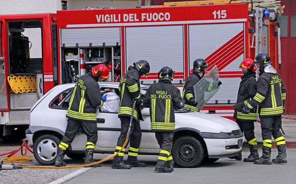 brave firefighters relieve an injured after a road accident