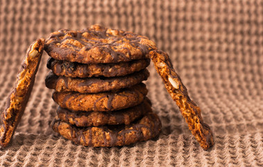 Chocolate chip cookies on linen napkin close up.