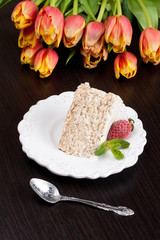 Classic Cake Napoleon of puff pastry with custard cream on a pla