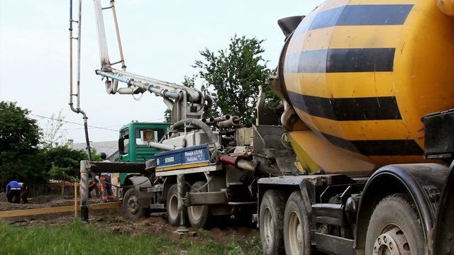 Truck mounted concrete pump operating in a construction site