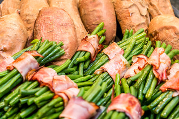 Green beans rolled in bacon and baked sweet potatoes
