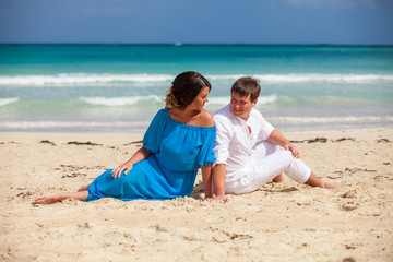 Beach couple walking on romantic travel.