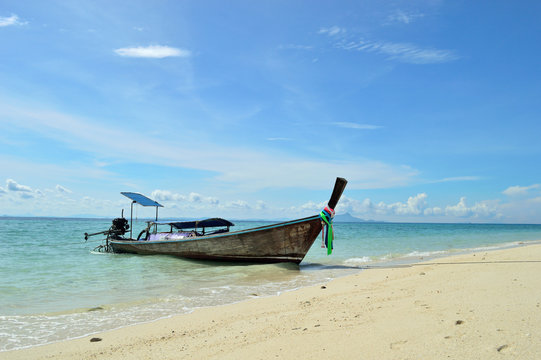 The wooden boat on a beach
