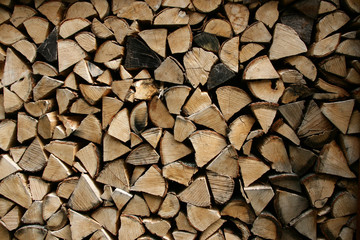 Pile of dried chopped firewood stacked for winter.