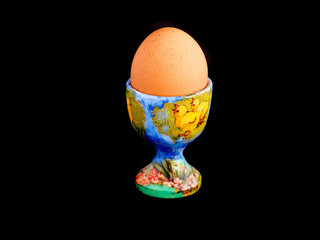 An egg on the egg cup