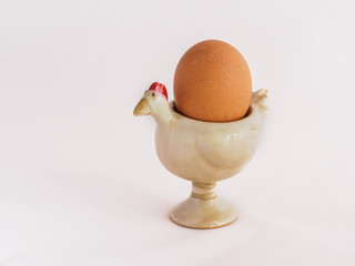 An egg on the egg cup with white background