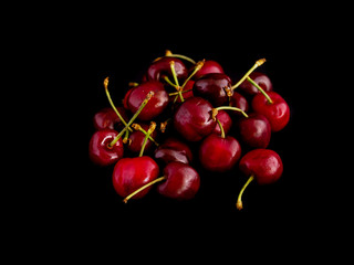 Fototapeta na wymiar Cherries on a black background