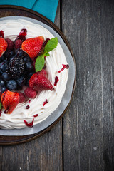 Homemade pavlova meringue with summer fresh berries