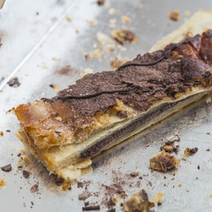 Chocolate cake piece on a silver shelf