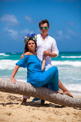 Beach couple walking on romantic travel.