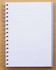 notebook on wooden background