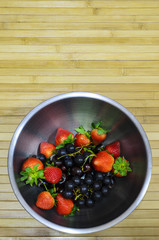 Fruit bowl on bamboo mat