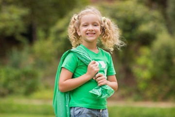 Eco friendly little girl smiling to camera 
