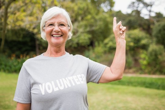 Happy volunteer grandmother with thumbs up 