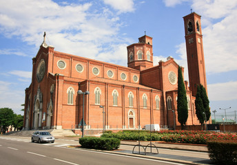 Fototapeta premium Red cathedral with a bell tower
