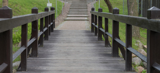 brown bridge in park