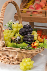 white and red bunch of grapes imitation in wicker basket