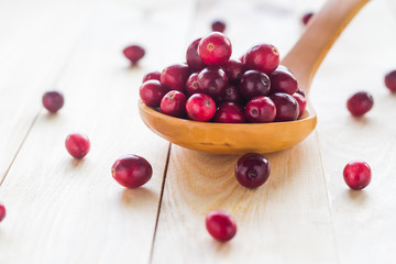 Cranberries wooden spoon background berry