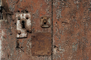 Old Rusty Keyhole on old grungy Wooden Door