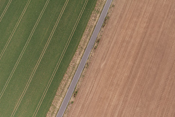 aerial view of spring time village harvest fields landscape