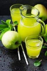Fresh apple juice and green apples