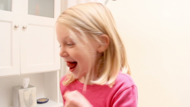 Little girl successfully pulls her front tooth
