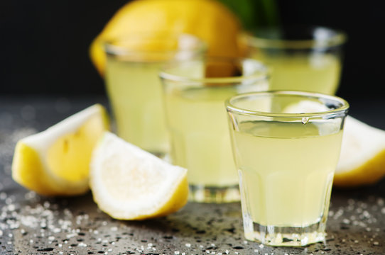 Italian traditional liqueur limoncello with lemon