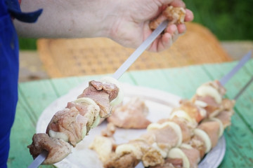 kebab skewers put on the meat on a skewer