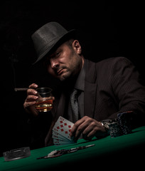 Male gambler playing poker.