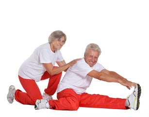 Obraz na płótnie Canvas Senior couple exercising 