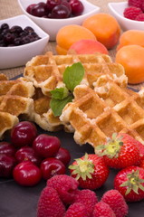 Belgian Waffles, fresh summer fruits with a sprig of mint