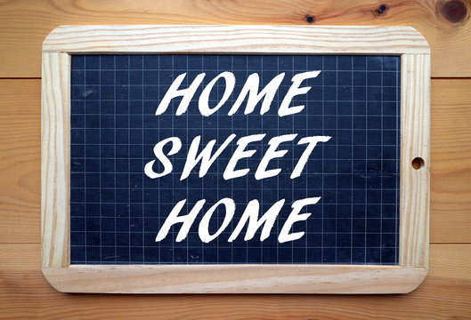The phrase Home Sweet Home written on a blackboard