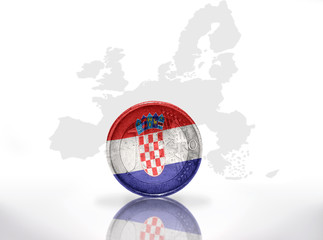 Naklejka premium euro coin with croatian flag on european union map background