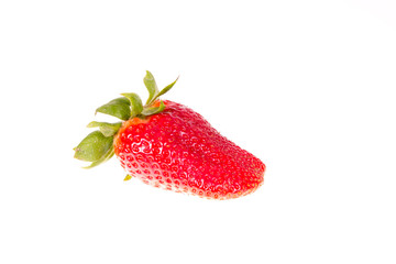 Child's hand picking strawberry from desert