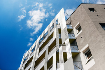 aluminum concrete facade and aluminum panels against blue clear