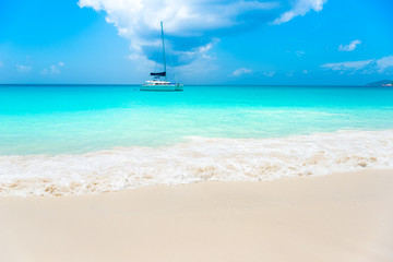 Fototapeta premium Boat at Paradise beach - Anse Georgette at Praslin, Seychelles
