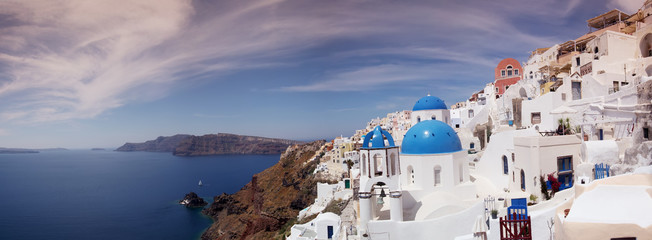 Blue and white church of Oia village on Santorini island. Greece