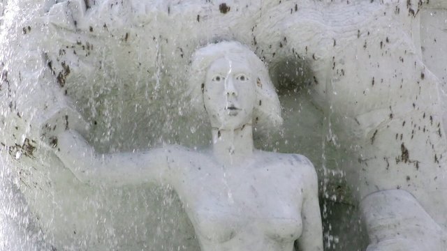 Waterfall and Marble Woman Statue in Fountain Pool