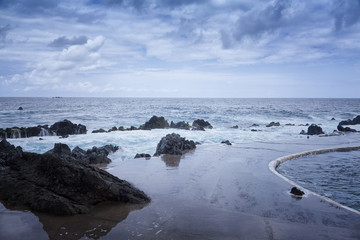 Rocky shore and natural pool. Porto Moniz, Madeira island, Portugal