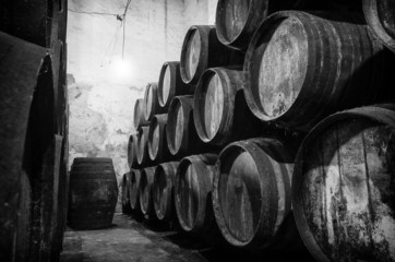 Whisky or wine barrels in black and white