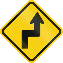 Colombian road warning sign: Reverse turn